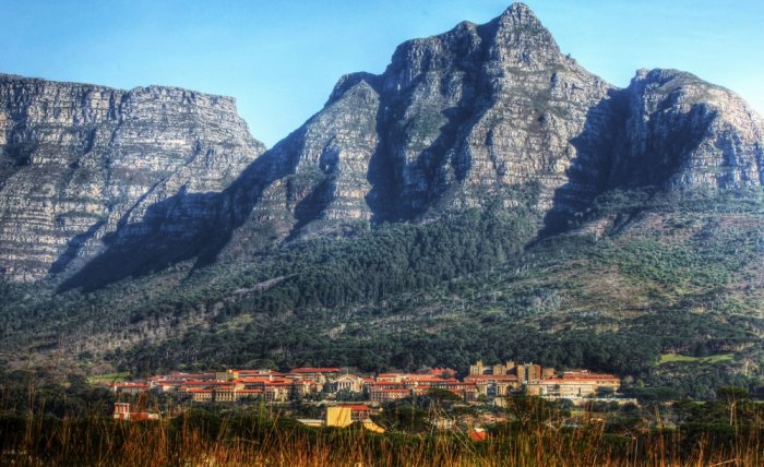 Table Mountain and the Devil's Mountain Summit are among the group of mountains that make up the mountain background in Cape Town, South Africa 