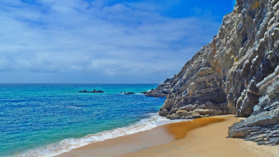 Praia de Adraga overlooks the Atlantic Ocean and is a 45-minute drive from Lisbon