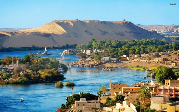 Aswan is another beautiful ancient city located on the banks of the Nile and bordered by the orange sand dunes