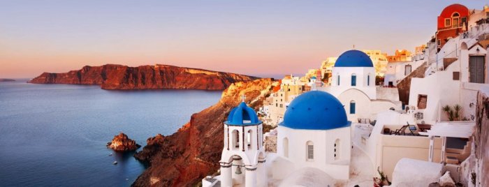 Santorini, which appears from afar as clusters of beautiful white buildings