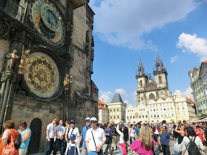Tourists gathered in front of the astronomical clock