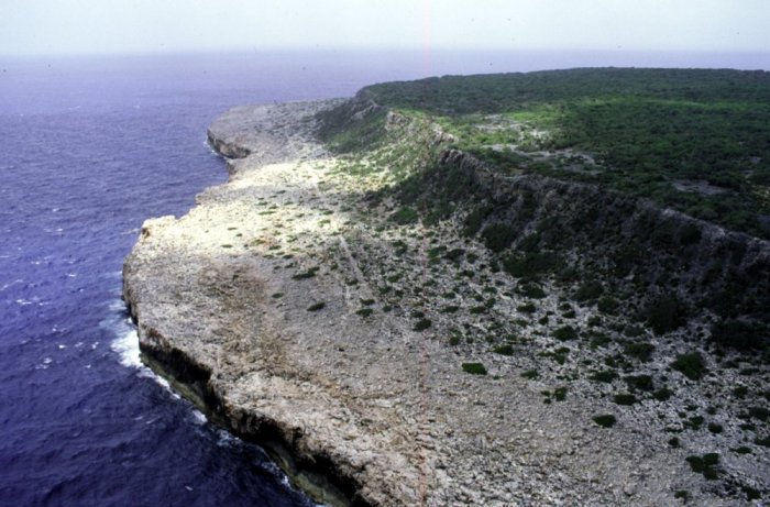 An uninhabited island located in the Caribbean