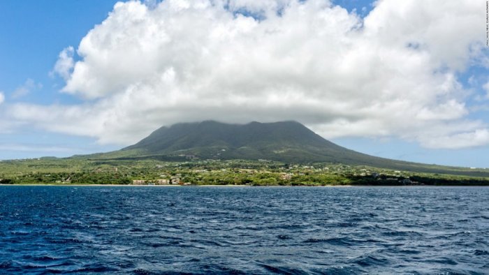 Mount Nevis volcanic crater covered with clouds