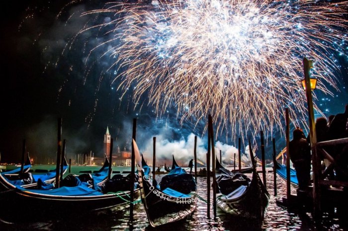 Watch fireworks from boats in Venice