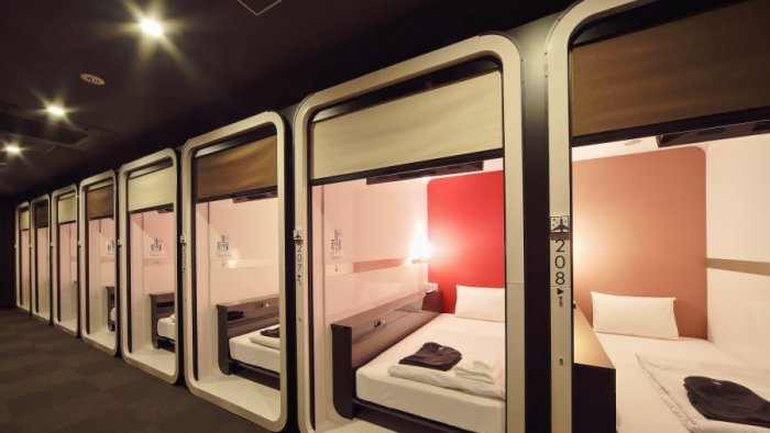 Choose accommodation in a capsule hotel