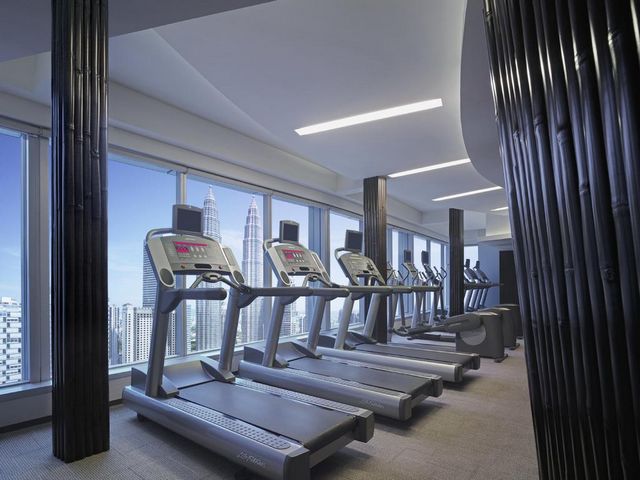A fitness center at Traders Hotel Kuala Lumpur is equipped with the latest equipment and technologies