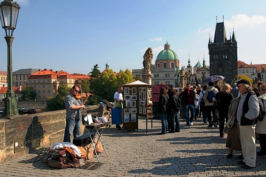Artists and sellers of the Charles Bridge in Prague