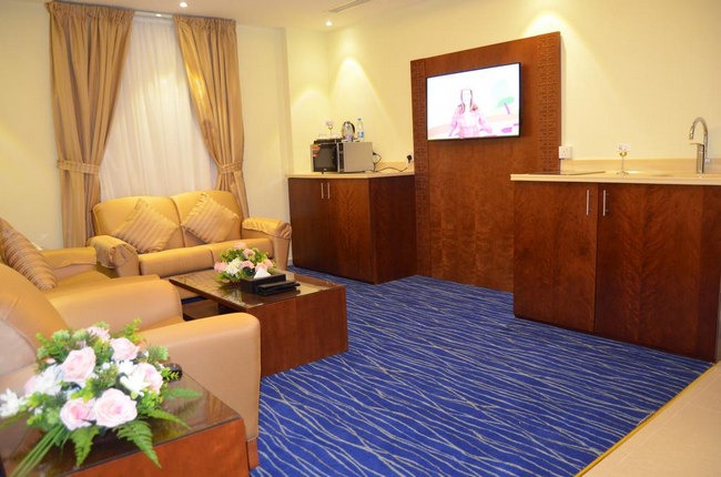 Luxurious seating area with flat screen in the best hotel apartments in Al Khobar