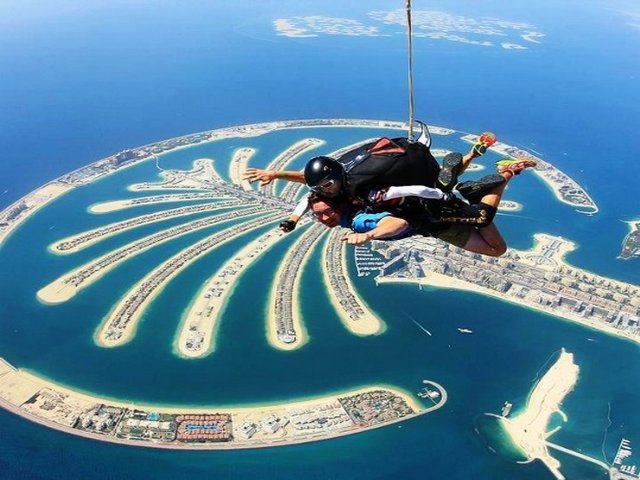 Parachutes jumped over the sky on the Palm Island