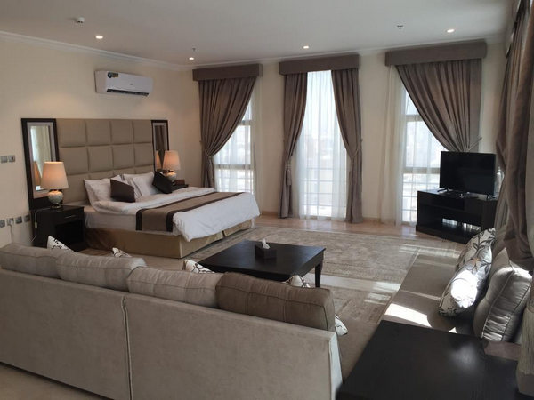 Luxurious seating area and TV screen in the cheapest furnished apartments in Jeddah