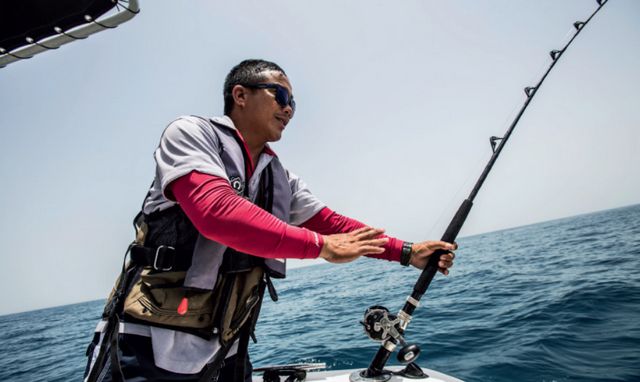 Fishing during a visit to Ajman Corniche