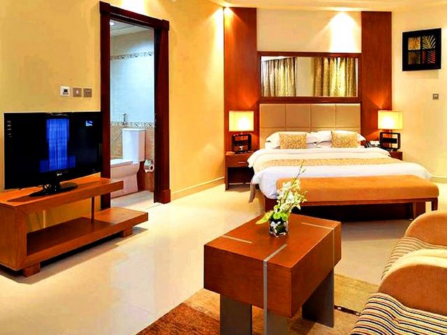 Room facilities at Pearl Park Hotel Dubai include a TV and sofa.