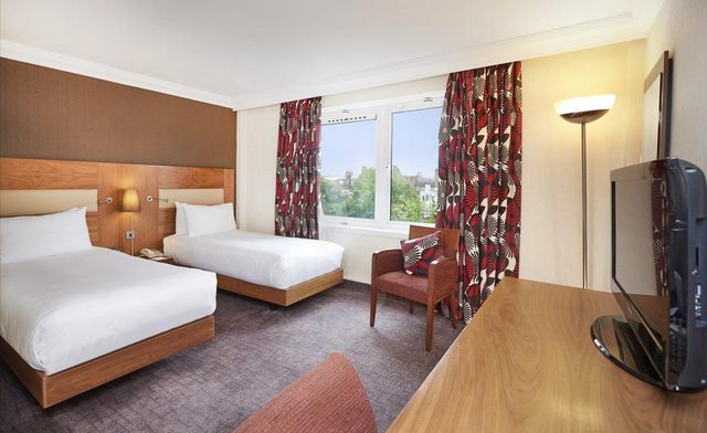 A report on the Hilton London Olympics features a spacious room