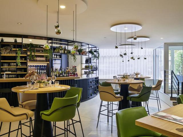 A restaurant at the Mercure Hotel La Defense France serves delicious French cuisine 