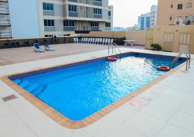 The outdoor swimming pool at Ramee Hotel Bahrain Juffair