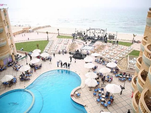 Sea View Hotel Alexandria features a private beach area in Al-Ajmi Beach, known for its white sand and clear waters.