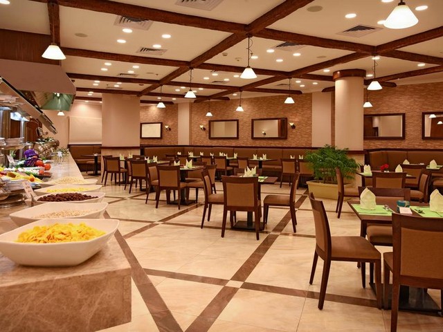 Buffet and seating areas at the Grand Plaza Hotel Alexandria